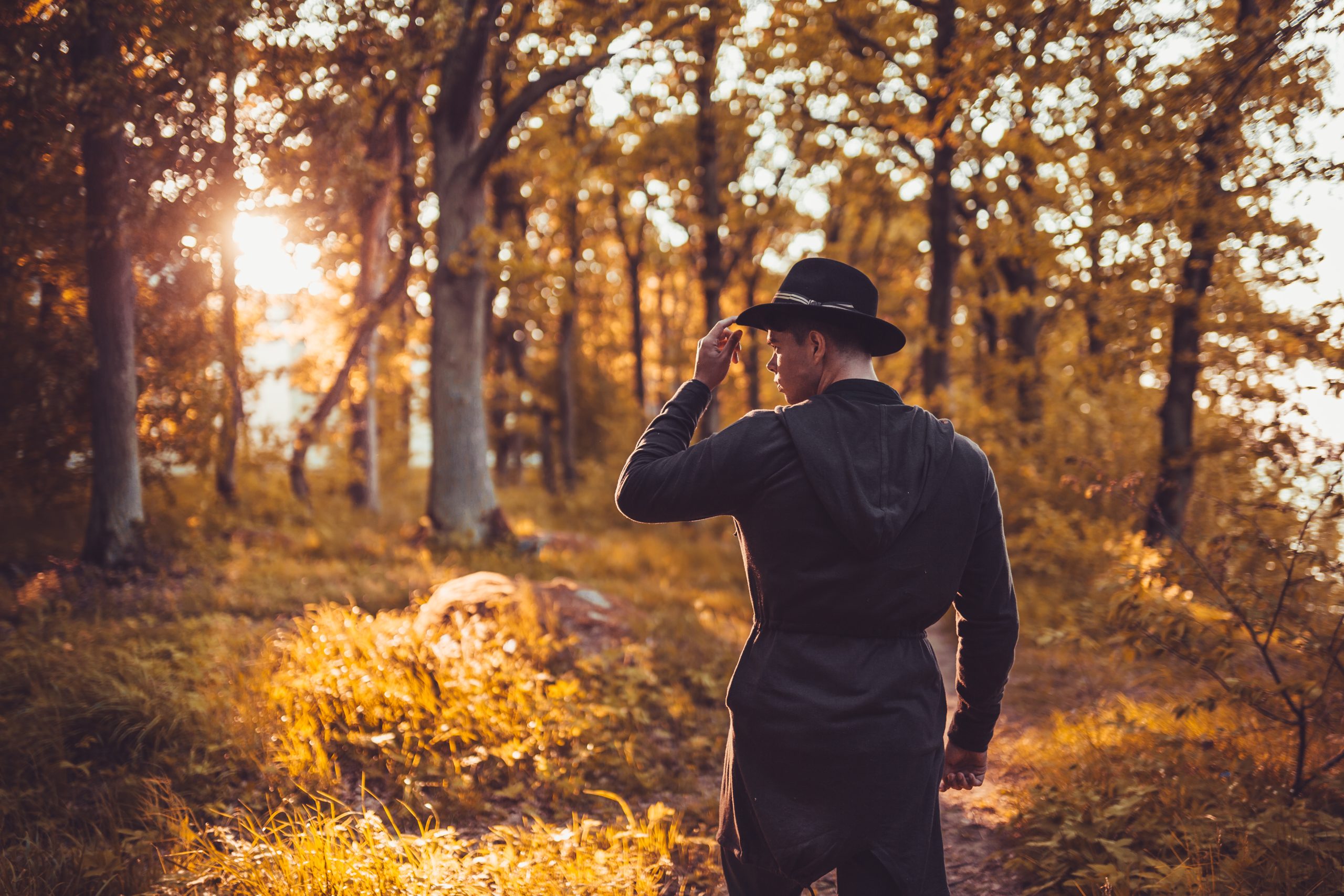 man-standing-forest-scaled